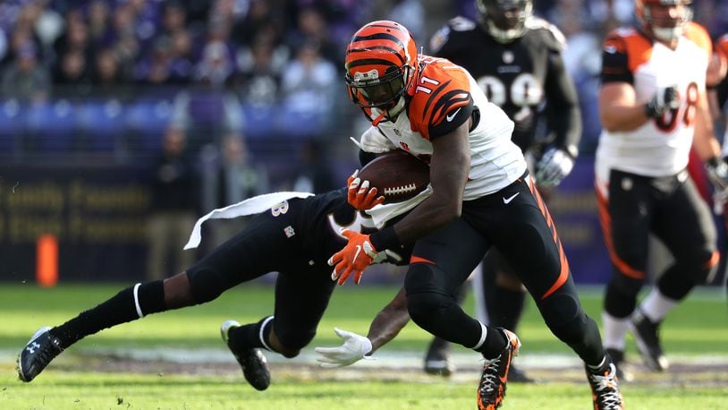 BALTIMORE, MD - NOVEMBER 27: Wide receiver Brandon LaFell #11 of the Cincinnati Bengals carries the ball past cornerback Tavon Young #36 of the Baltimore Ravens in the first quarter at M&T Bank Stadium on November 27, 2016 in Baltimore, Maryland. (Photo by Rob Carr/Getty Images)