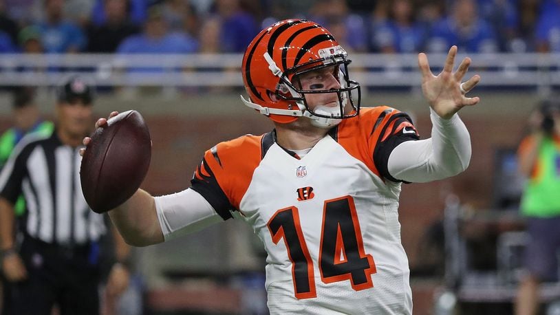 DETROIT, MI - AUGUST 18: Andy Dalton #14 of the Cincinnati Bengals rolls out and looks downfield during the first quarter of the preseason game against the Detroit Lions at Ford Field on August 18, 2016 in Detroit, Michigan. (Photo by Leon Halip/Getty Images)