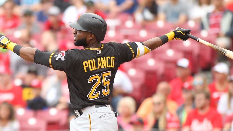 The Pirates' Gregory Polanco hits a two-run home run against the Reds on Sunday, July 22, 2018, at Great American Ball Park in Cincinnati.