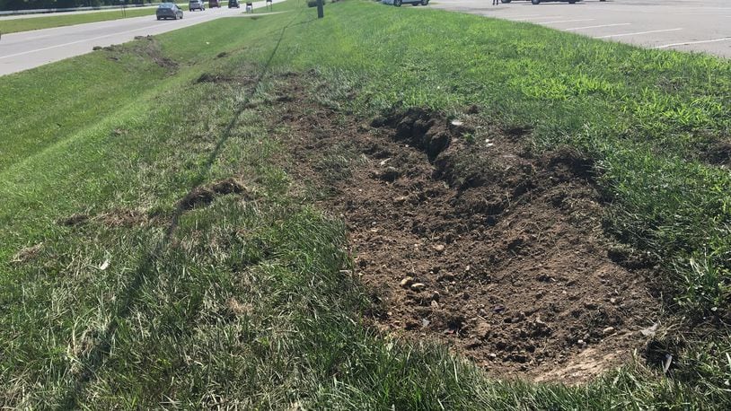 The scene of the crash on U.S. 40 in Springfield near The Meadows Restaurant. Debris littered the side of the road, including pieces of the stolen police cruiser. JENNA LAWSON/STAFF.