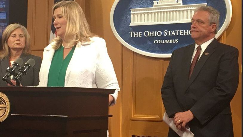 Dayton Mayor Nan Whaley, at podium, speaks at a press conference Thursday in Columbus to introduce legislation to form a cabinet-level office to coordinate drug policy in Ohio. Also pictured are Whitehall Mayor Kim Maggard, to the left of Whaley, and State Rep. Richard Brown, D-Canal Winchester, right. KATIE WEDELL/STAFF