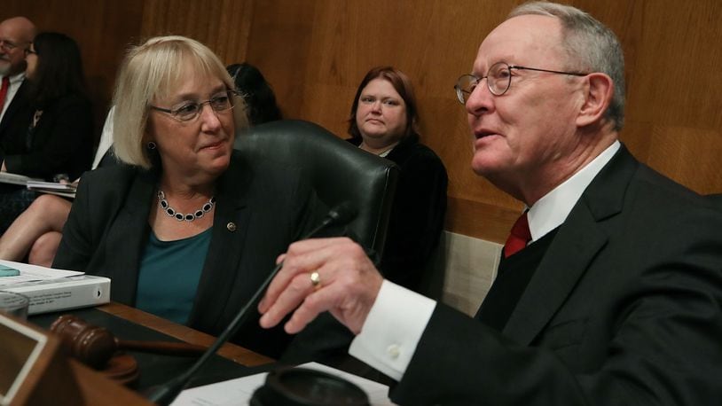 WASHINGTON, DC - OCTOBER 19: Chairman Lamar Alexander (R-TN) and ranking member Sen. Patty Murray (D-WA) confer during a Senate Health, Education, Labor and Pensions committee hearing on Capitol Hill October 19, 2017 in Washington, DC. Later today the two Senators will present to the Senate a possible bi partisan agreement to fund key Affordable Care Act. insurance subsidies. (Photo by Mark Wilson/Getty Images)