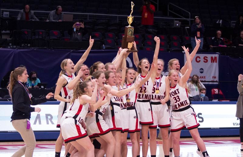 Fort Loramie's girls basketball team celebrates a Division IV state championship Saturday at UD Arena. Jeff Gilbert/CONTRIBUTED