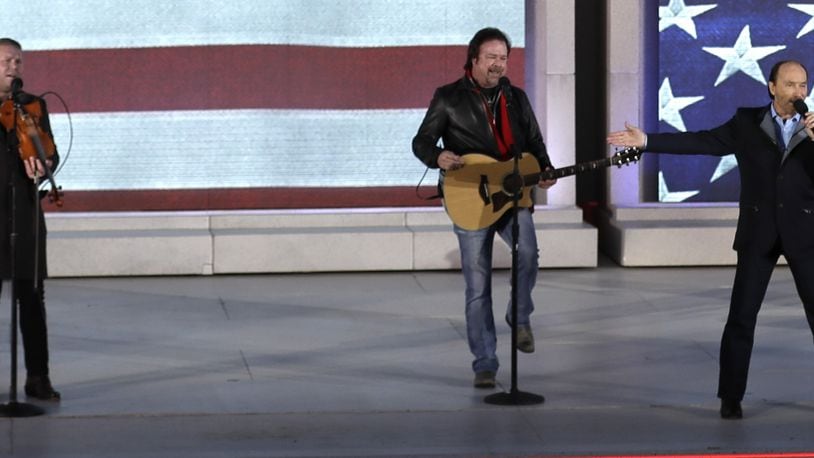 Donnie Reis, left, performs with Lee Greenwood, right,  at a pre-Inaugural “Make America Great Again! Welcome Celebration” at the Lincoln Memorial in Washington, Thursday, Jan. 19, 2017. (AP Photo/David J. Phillip)
