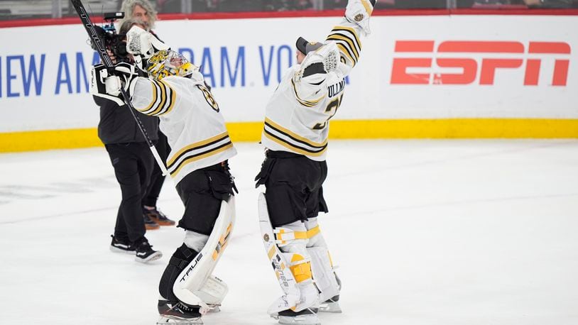 Boston Bruins goaltenders Jeremy Swayman, left, Linus Ullmark celebrate after the Bruins beat the Florida Panthers 5-1 in Game 1 of the second-round series of the Stanley Cup Playoffs, Monday, May 6, 2024, in Sunrise, Fla. (AP Photo/Wilfredo Lee)