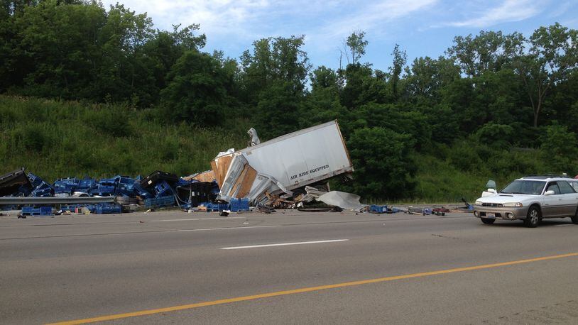 A semi involved in a crash on I-70 spilled a large portion of its cargo onto the highway Tuesday, June 18, 2013. (Teesha McClam)