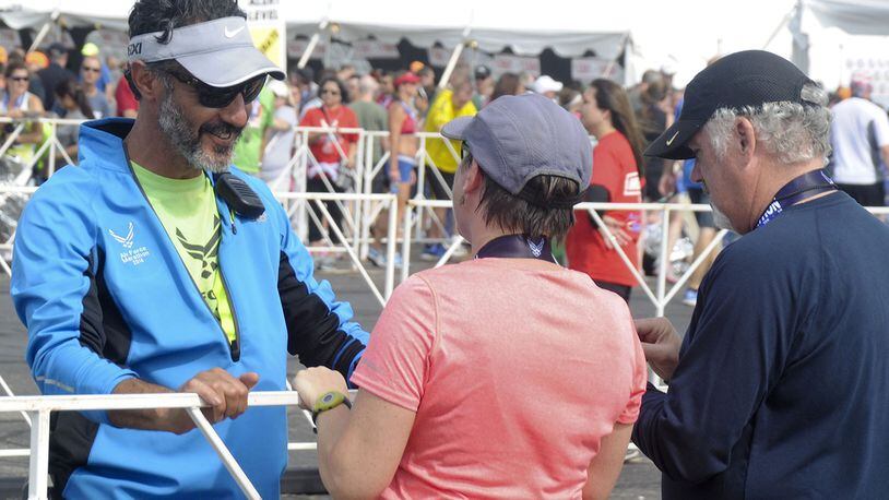 Former Air Force Marathon Director Rob Aguiar (at left, in blue jacket) at a past marathon. CONTRIBUTED