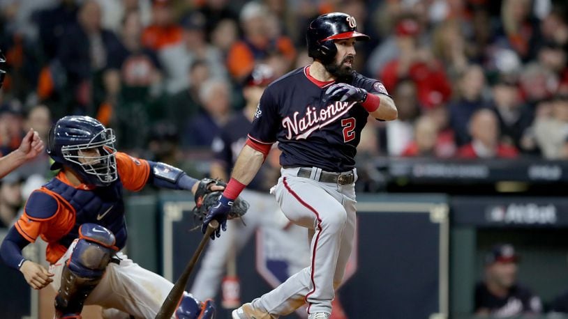 The Nationals’ Adam Eaton hits a two-run single against the Houston Astros during the ninth inning in Game Seven of the 2019 World Series at Minute Maid Park on October 30, 2019 in Houston, Texas. (Photo by Elsa/Getty Images)