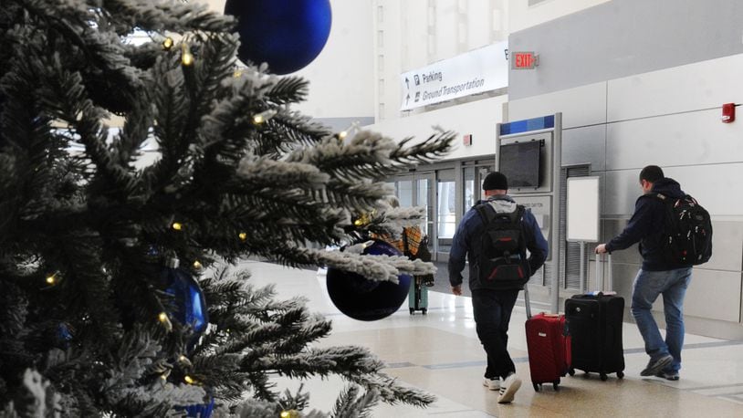 Holiday travel is expected to be up this year nationwide and in Ohio including the Dayton International Airport and almost back to pre-pandemic levels. MARSHALL GORBY\STAFF