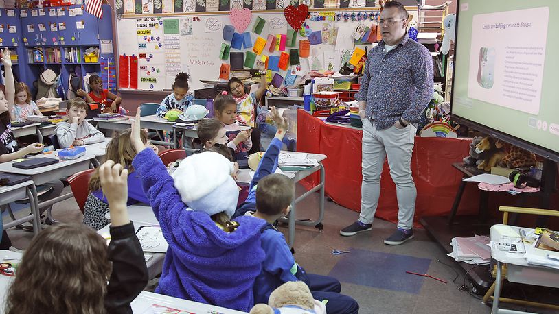 Joseph Fultz, teaches his third grade class as Simon Kenton Elementary Thursday, March 7, 2024. BILL LACKEY/STAFF