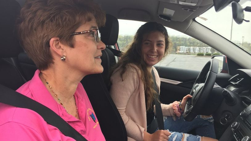 Braelen Devoe, a 16-year-old Centerville High School student, practices maneuverability with Sharon Fife, owner of D&D Driving School. Devoe said she doesn’t think the the state should pass a bill that would make teenagers hold their permit for a full year because teenagers need their driver’s licenses so their parents don’t have to taxi them around everywhere. STAFF PHOTO / HOLLY SHIVELY