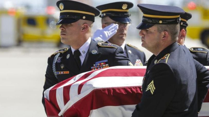 The remains of US Army Sgt. Richard Sowell are moved to a hearse by the US Army Honor Guard after arriving at PBIA Wednesday, November 8, 2017. “Tiny” Sowell’s buddies saw the popular Palm Beach High grad be blown to bits by Japanese explosives on Saipan, but they couldn’t get to his mangled body to bring him home. It would take seven decades, and 21st century technology, and a persistent nephew, but Tiny finally is coming home.