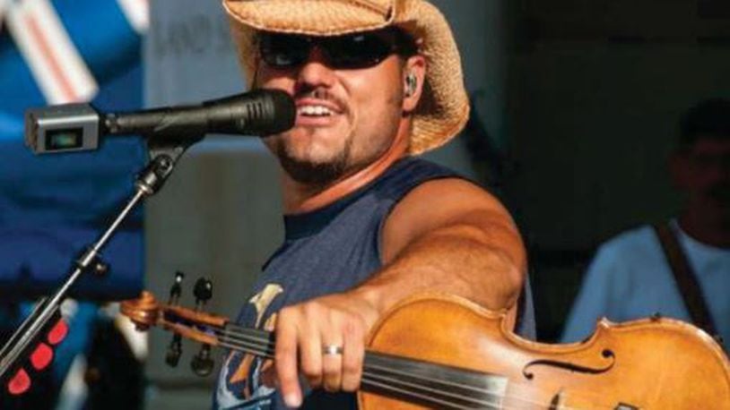 Country performer Chris Higbee will his bring a high-energy country sound to the fair’s big tent with covers and original tunes including one dedicated to his active duty military wife on Wednesday, July 26. Contributed photo