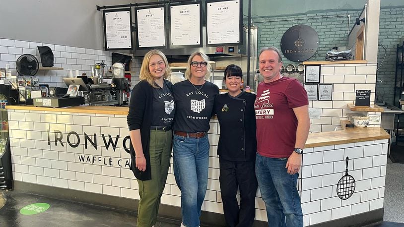 Springfield entrepreneurs Lisa and Dan Freeman, who own Le Torte Dolci Bakery, Salato Deli and Crust & Company, are creating an “umbrella brand” for their businesses as they announce the purchase of Ironworks Waffle Café. Pictured left to right are Ellie and Marcy Nesselroade, who are selling Ironworks, and Lisa and Dan Freeman. CONTRIBUTED