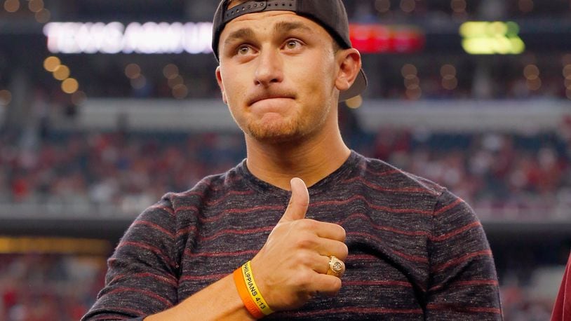ARLINGTON, TX - SEPTEMBER 27: Johnny Manziel #2 of the Cleveland Browns reacts after receiving his Aggie Ring during half time of the Southwest Classic at AT&T Stadium on September 27, 2014 in Arlington, Texas. (Photo by Tom Pennington/Getty Images)