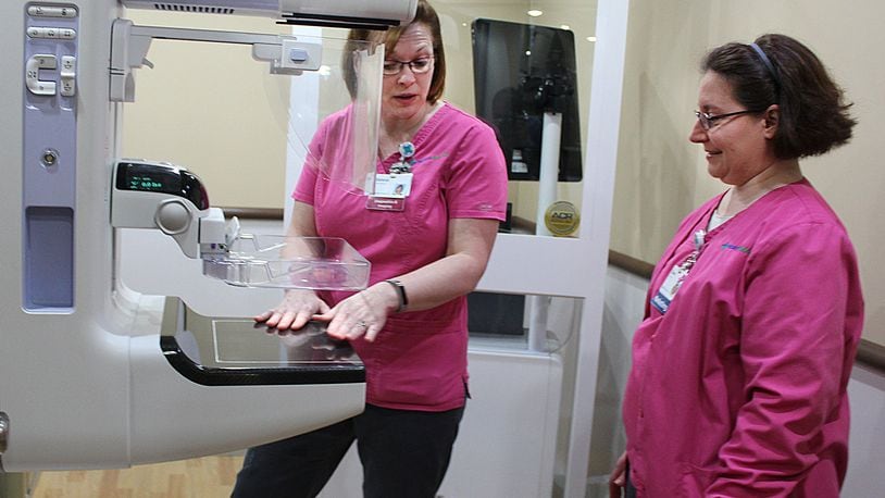 Selena Kemper (left) and Dawn Naill with Mercy Health Mobile Mammography inside the 3D mobile mammography vehicle. JEFF GUERINI/STAFF