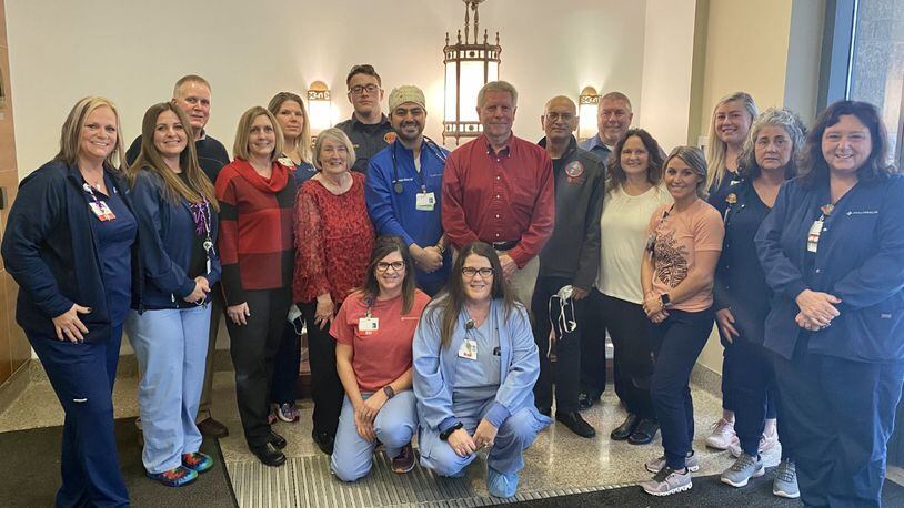 Greg Brumfield is pictured here with Mercy Health Springfield Regional Medical Center employees who saw him through his emergency surgery and recovery. Photo provided by Mercy Health.