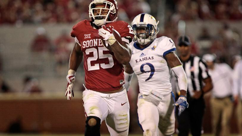 NORMAN, OK - OCTOBER 29: Running back Joe Mixon #25 of the Oklahoma Sooners runs the sideline against the Kansas Jayhawks October 29, 2016 at Gaylord Family-Oklahoma Memorial Stadium in Norman, Oklahoma. The Sooners defeated the Jayhawks 56-3. (Photo by Brett Deering/Getty Images)