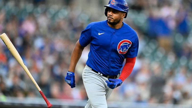 Chicago Cubs' Jeimer Candelario flips his bat after hitting a two-run home run off Detroit Tigers starting pitcher Reese Olson during the fourth inning of a baseball game Tuesday, Aug. 22, 2023, in Detroit. (AP Photo/Jose Juarez)
