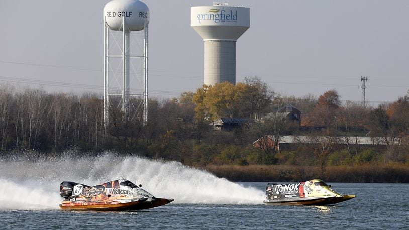 Formula 1 racing boats roar across the lake at the Clark County Fairgrounds Wednesday as Clark County conducts a feasibility study to see if power boat races can be brought to the area. Bill Lackey/Staff