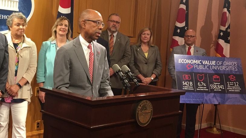 Ohio State University president Michael Drake speaks at the Statehouse on Tuesday about why higher education is a good investment. Behind him are Central State University president Cynthia Hammond-Jackson and Wright State University president Cheryl Schrader.