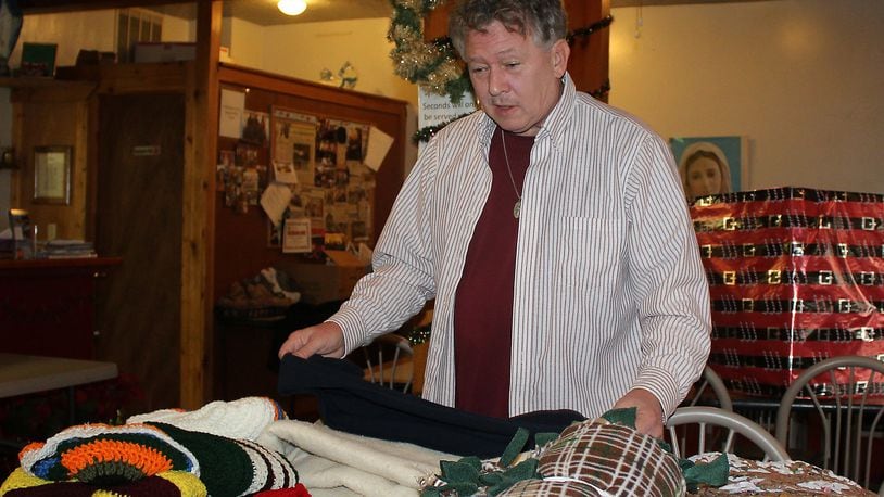 Fred Stegner with the Springfield Soup Kitchen makes sure blankets, hats and gloves are available for the coming winter season. JEFF GUERINI/STAFF