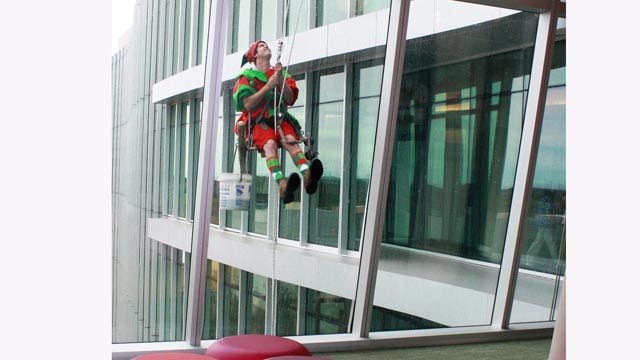 High flying elves wash windows at Nemours Children's Hospital in Orlando