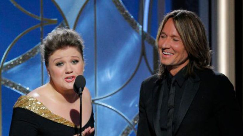BEVERLY HILLS, CA - JANUARY 07:  In this handout photo provided by NBCUniversal,  Presenters Kelly Clarkson and Keith Urban  speak onstage during the 75th Annual Golden Globe Awards at The Beverly Hilton Hotel on January 7, 2018 in Beverly Hills, California.  (Photo by Paul Drinkwater/NBCUniversal via Getty Images)