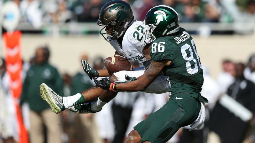 Fairfield High School graduate Josiah Scott (22) comes up with an interception during Michigan State’s spring football game April 1 in East Lansing, Mich. PHOTO COURTESY OF MICHIGAN STATE ATHLETICS
