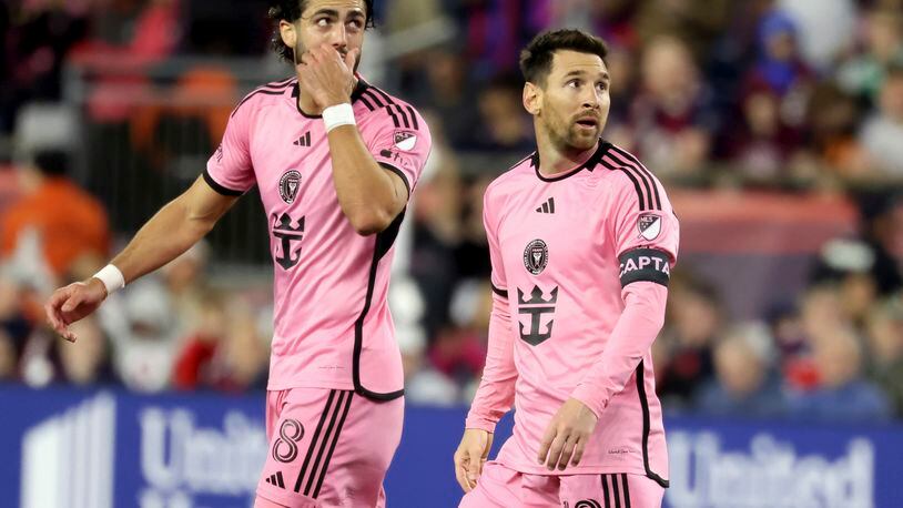 Inter Miami forwards Leonardo Campana (8) and Lionel Messi (10) watch the replay of Messi's goal in the first half of an MLS soccer match against the New England Revolution, Saturday, April 27, 2024, in Foxborough, Mass. (AP Photo/Mark Stockwell)