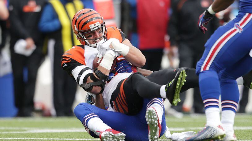ORCHARD PARK, NY - OCTOBER 18: Tyler Eifert #85 of the Cincinnati Bengals is tackled by Corey Graham #20 of the Buffalo Bills after the catch during the first half at Ralph Wilson Stadium on October 18, 2015 in Orchard Park, New York. (Photo by Brett Carlsen/Getty Images)