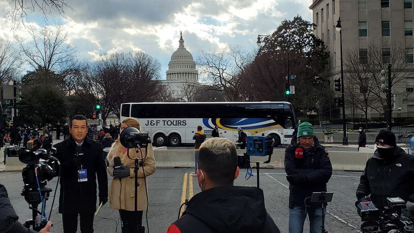 Downtown Washington DC saw few crowds Wednesday because of security measures and COVID-19 cancellations of parades and parties.