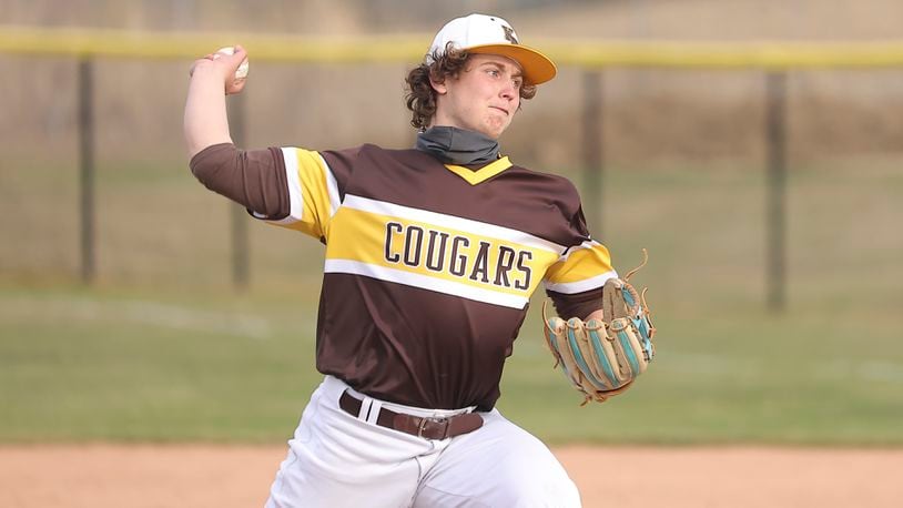 Cutline: Kenton Ridge High School senior Evan Houseman pitches during their scrimmage game against Oakwood on Monday, March 22 at Tom Randall Field in Springfield. Michael cooper/CONTRIBUTED