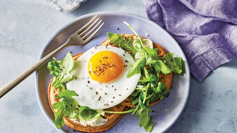 Wednesday’s Waffles With Arugula, Fried Egg and Goat Cheese Butter is the perfect breakfast for dinner. Contributed by Time Inc. Books/Caitlin Bensel