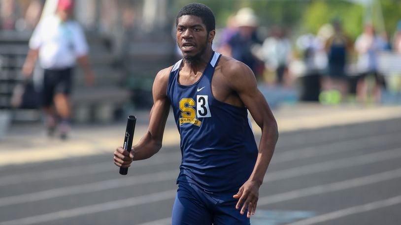 Springfield High School junior Charles Brown runs the anchor leg for the 1,600 meter relay at the Ohio High School Athletic Association's Division I state track and field championships on Saturday afternoon at Hilliard Darby High School. CONTRIBUTED PHOTO BY MICHAEL COOPER