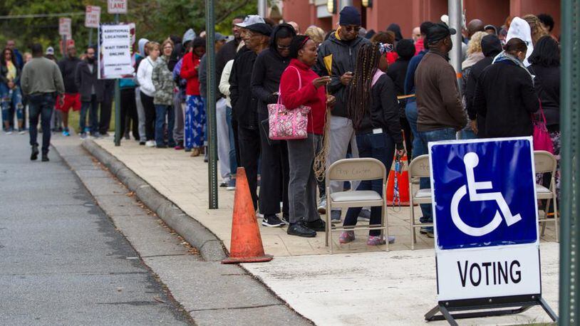 People wait in a long line to vote Saturday at the Cobb County Board of Elections and Registration office in Marietta, Georgia, October 27, 2018. (Photo: Steve Schaefer/The Atlanta Journal-Constitution)