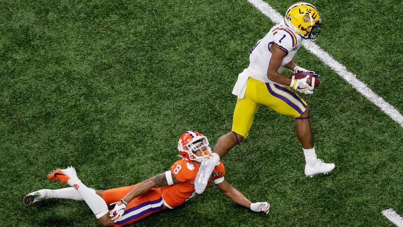 LSU wide receiver Ja'Marr Chase scores past Clemson cornerback A.J. Terrell during the first half of a NCAA College Football Playoff national championship game Monday, Jan. 13, 2020, in New Orleans. (AP Photo/Eric Gay)