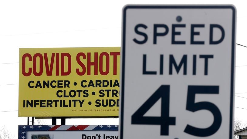 A billboard along Upper Valley Pike that tells people COVID vaccinations cause health issues has drawn fire from Clark County health officials, who refute the claims made. BILL LACKEY/STAFF