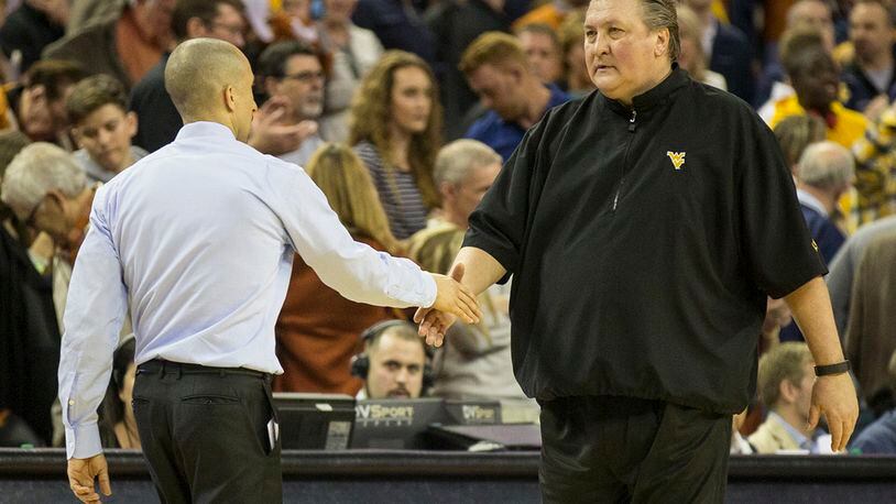Texas Head Coach Shaka Smart shank hands with West Virginia Bob Huggins at the end of the NCAA game on Saturday Jan 14, 2017 at the frank Erwin Center. West Virginia beat Texas 74-72 RICARDO B. BRAZZIELL/AMERICAN-STATESMAN