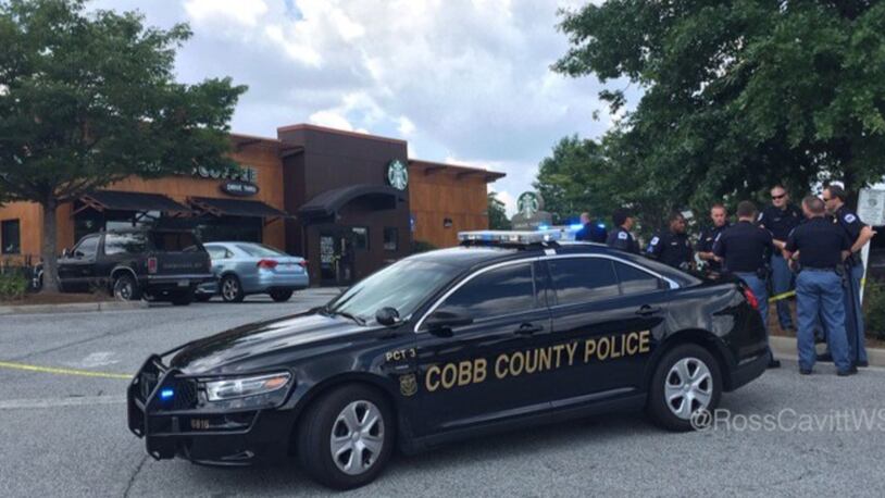 A woman walked inside an Atlanta-area Starbucks and said she was shot, Cobb County police said.