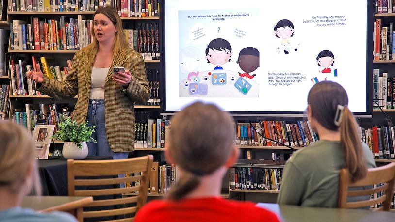 Hannah Spitzer, a former Shawnee High School student, talks about publishing the children's book she wrote and illustrated Friday, April 19, 2024 at her alma mater. BILL LACKEY/STAFF