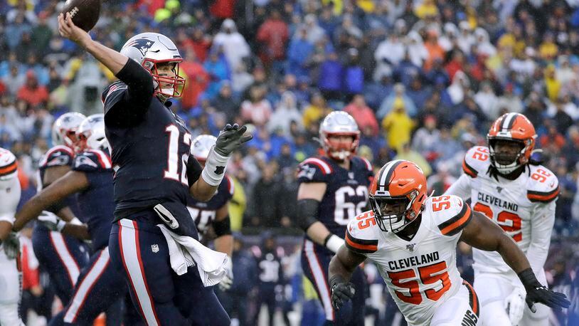New England Patriots quarterback Tom Brady passes under pressure from Cleveland Browns linebacker Genard Avery (55) in the first half of an NFL football game, Sunday, Oct. 27, 2019, in Foxborough, Mass. (AP Photo/Steven Senne)