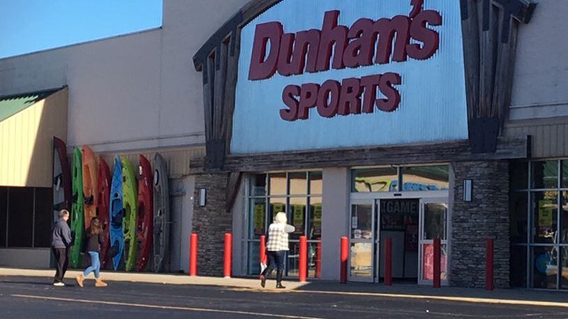 Dunham’s Sports returned to the same location they once inhabited on Upper Valley Pike and had a ribbon cutting ceremony Friday morning. BILL LACKEY/STAFF