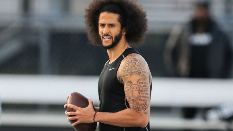 Colin Kaepernick looks to make a pass during a private NFL workout held at Charles R Drew high school on November 16, 2019 in Riverdale, Georgia. Due to disagreements between Kaepernick and the NFL the location of the workout was abruptly changed.