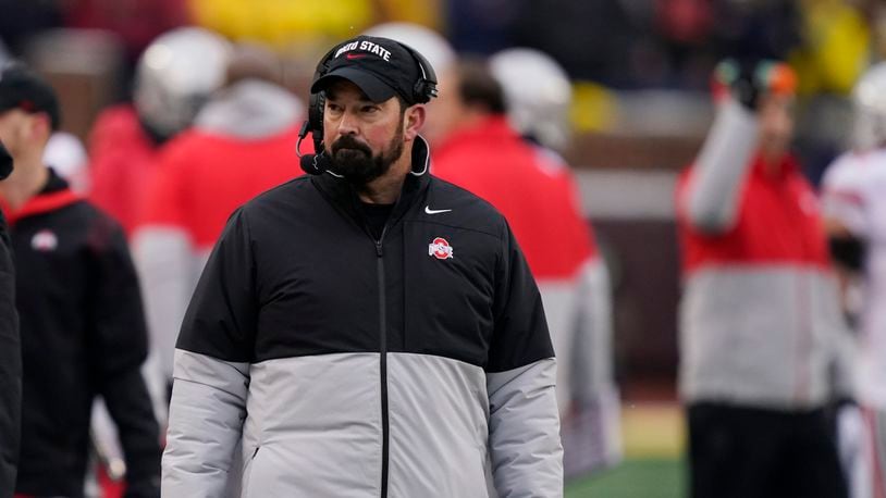 Ohio State head coach Ryan Day walks the sideline during the second half of an NCAA college football game against Michigan, Saturday, Nov. 27, 2021, in Ann Arbor, Mich. (AP Photo/Carlos Osorio)