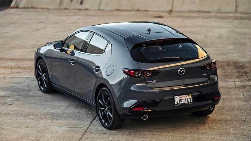 This photo provided by Mazda USA shows the 2020 Mazda 3, which is available as a sedan or a hatchback. Both body styles are available with all-wheel drive. (Courtesy of Mazda USA via AP)
