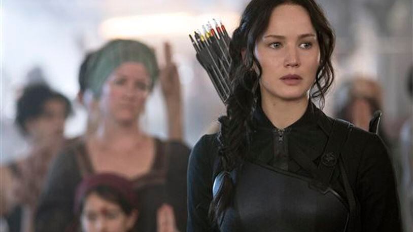 In this image released by Lionsgate, Jennifer Lawrence portrays Katniss Everdeen in a scene from "The Hunger Games: Mockingjay Part 1." (AP Photo/Lionsgate, Murray Close)