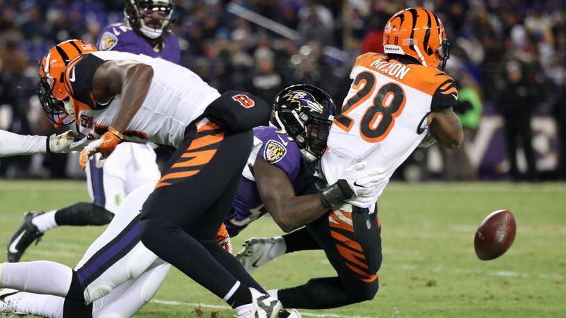 BALTIMORE, MD - DECEMBER 31: Running back Joe Mixon #28 of the Cincinnati Bengals fumbles the ball in the second quarter against the Baltimore Ravens at M&T Bank Stadium on December 31, 2017 in Baltimore, Maryland. (Photo by Rob Carr/Getty Images)