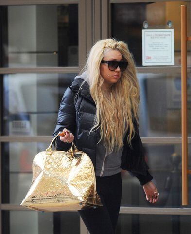 Amanda Bynes' neighbors spoke out about her creepy neighbor behavior, how she "stares blankly" at them, roams the hallways muttering to herself, screams, "You're ugly!" at them!