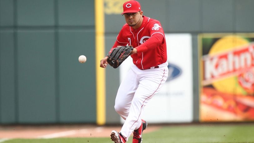 Reds third baseman Eugenio Suarez fields a ball against the Nationals on Saturday, March 31, 2018, at Great American Ball Park in Cincinnati. David Jablonski/Staff
